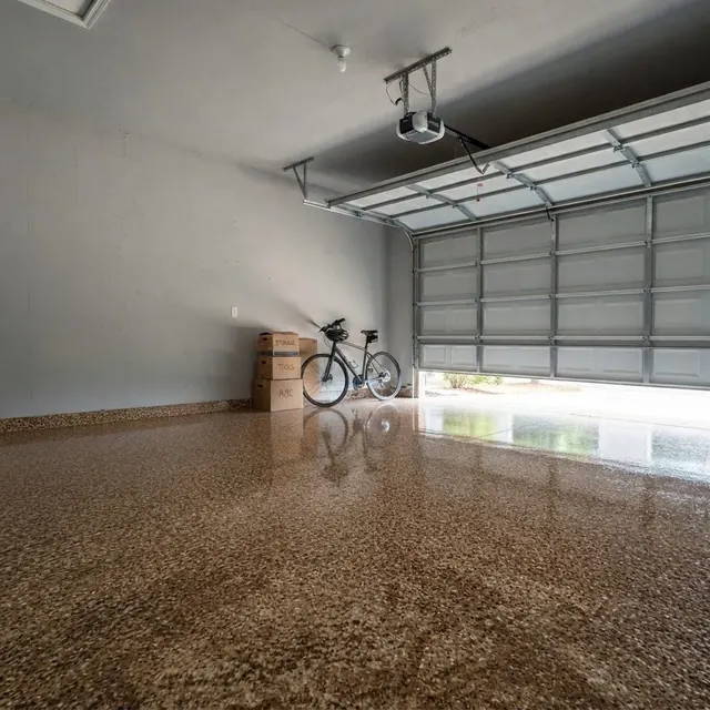 The same garage shown with a tan flake floor